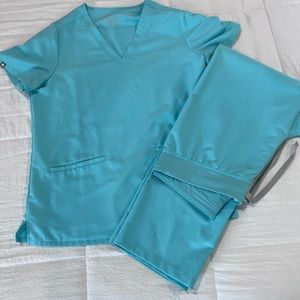 Figs scrubs. Sea foam green is how I’d describe the color. Excellent con.